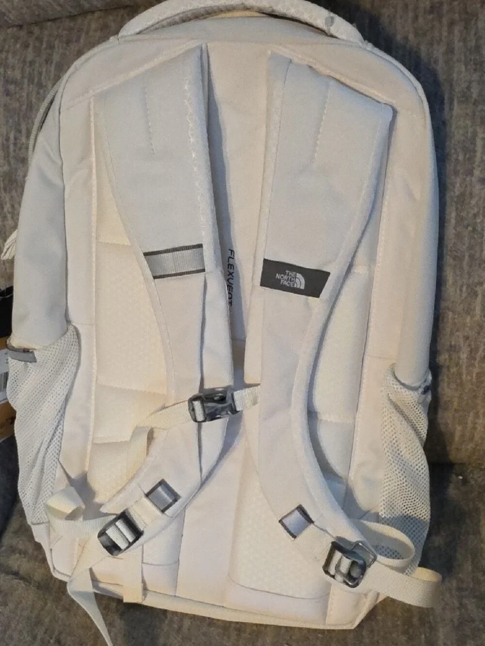 The North Face Jester Luxe Backpack - Cream/Light Beige with Rose Gold Accents.